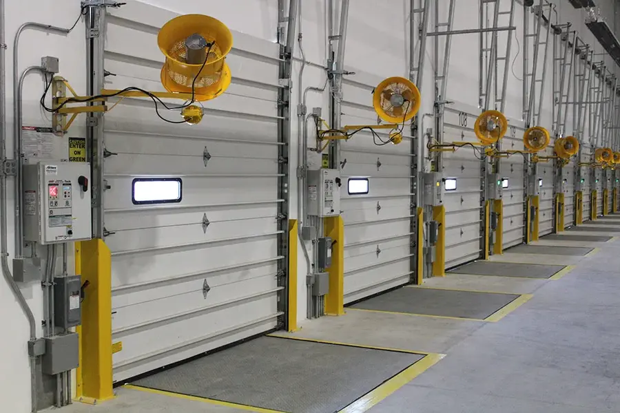 Dock bumpers protecting warehouse wall
