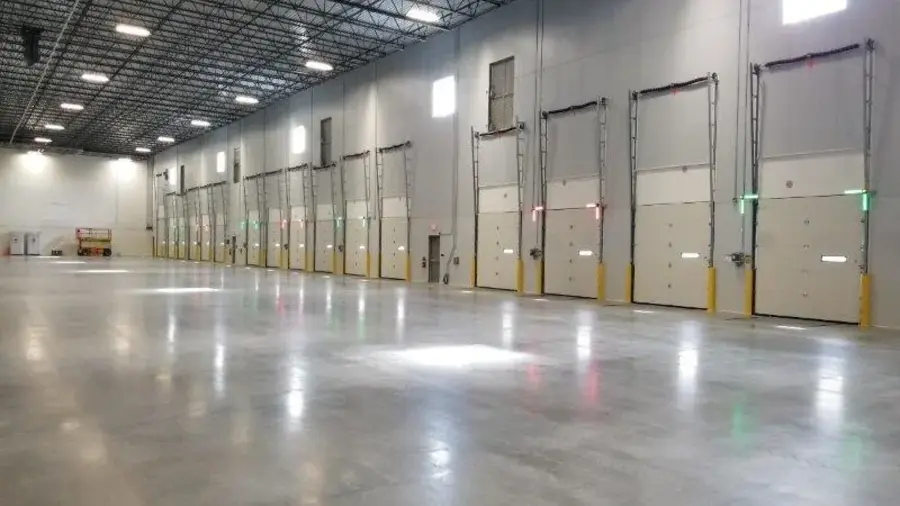 Mechanical dock leveler in stored position