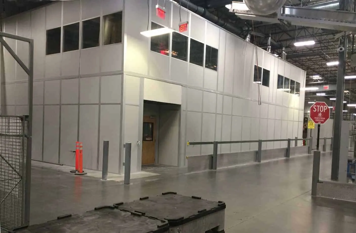Modular office above racking on mezzanine level