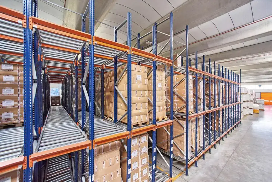 Forklift loading pallet into pallet flow system