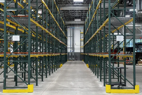 Forklift accessing pallet racking aisle