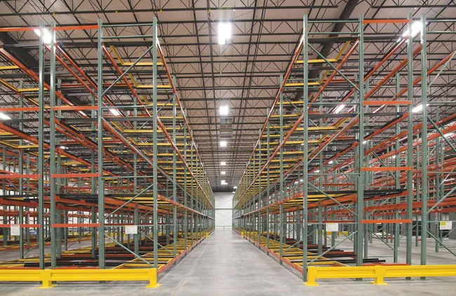 Push-back racking in manufacturing storage area