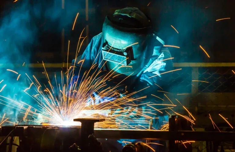 Custom steel fabrication in warehouse workshop