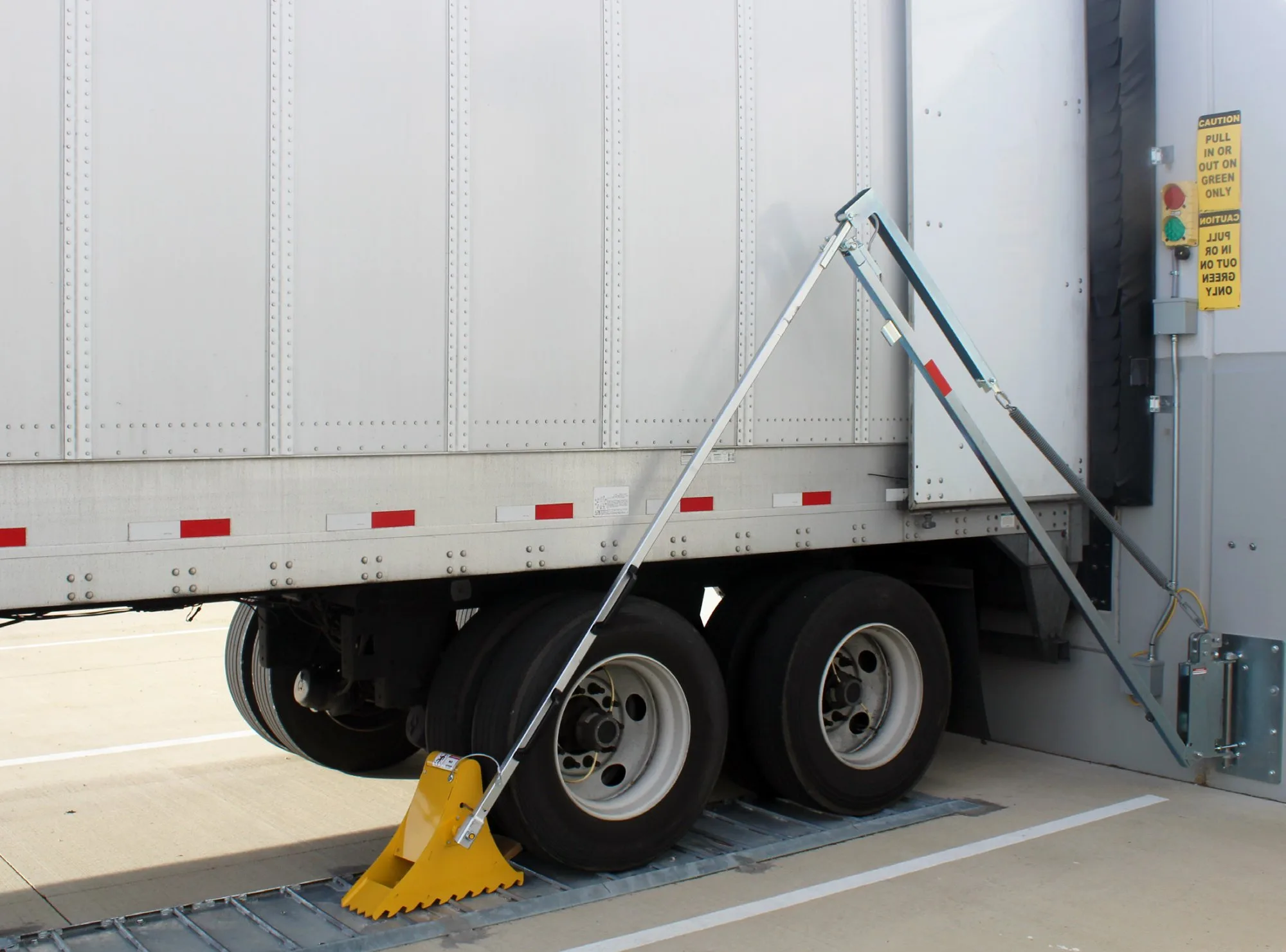 Automatic vehicle restraint at busy warehouse dock
