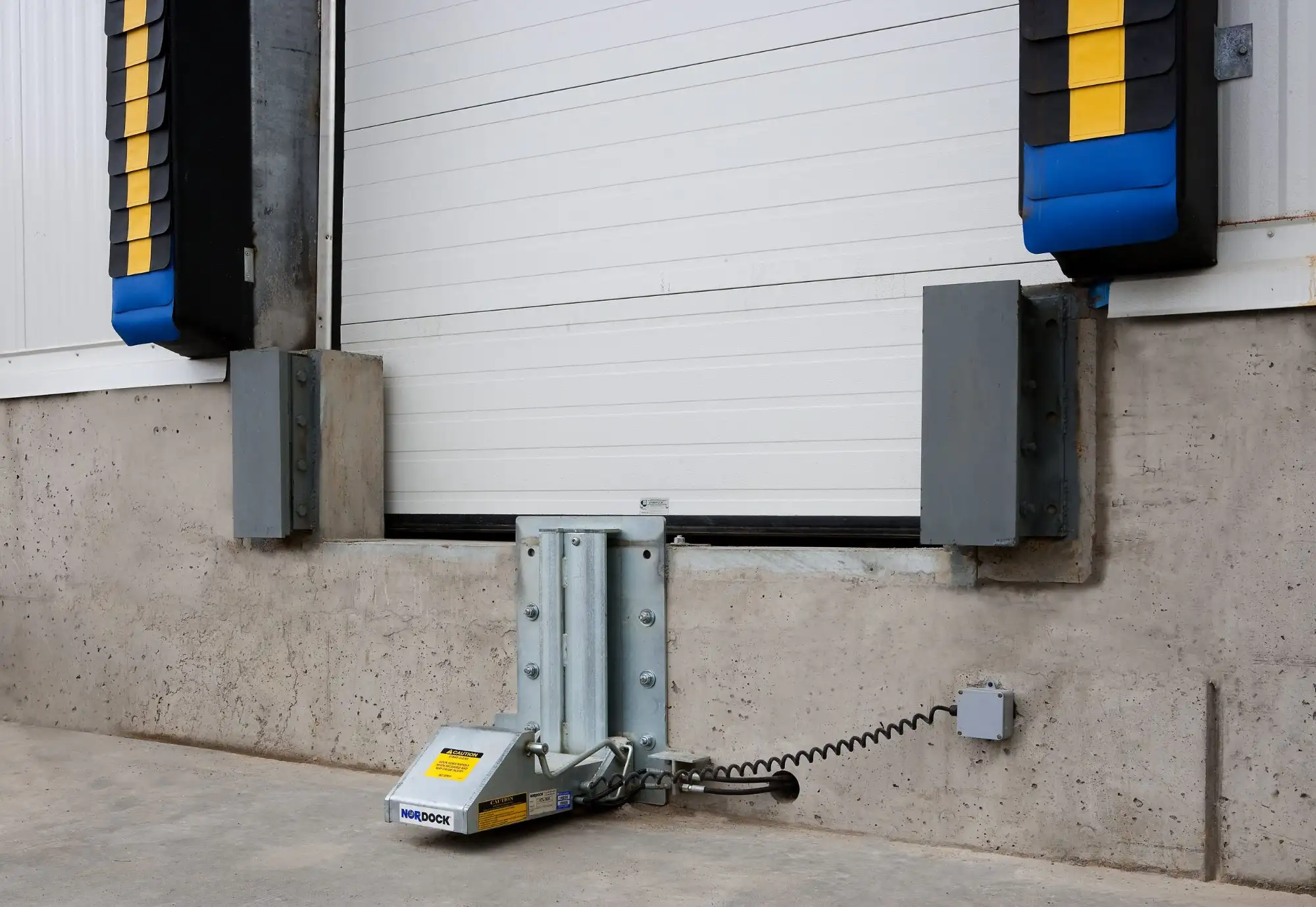 Vehicle restraint paired with dock leveler system