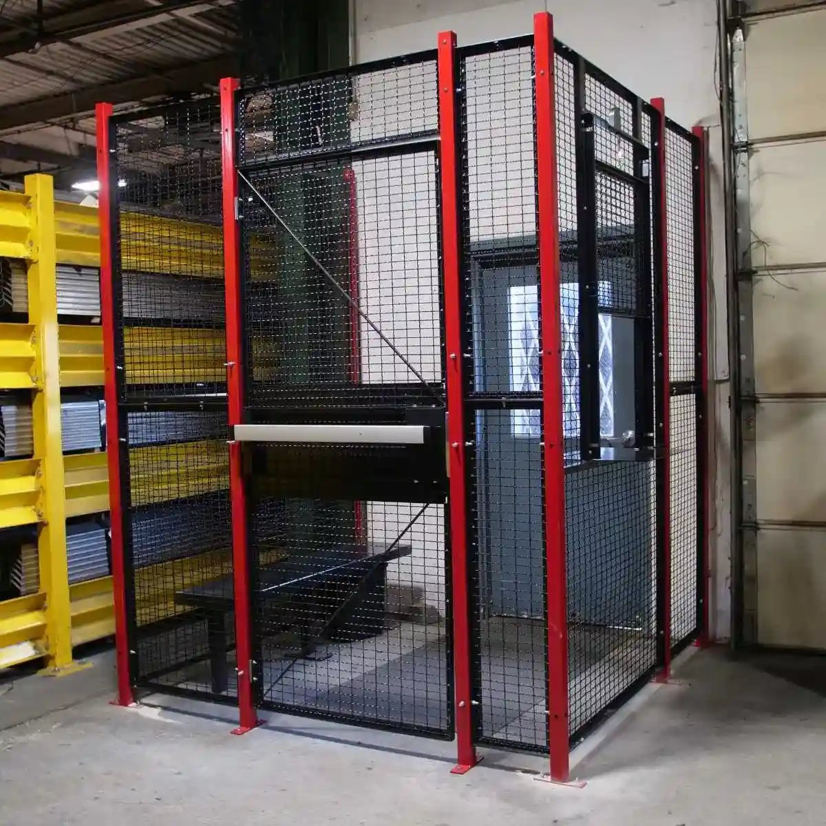 Wire mesh partitions and security cages in warehouse